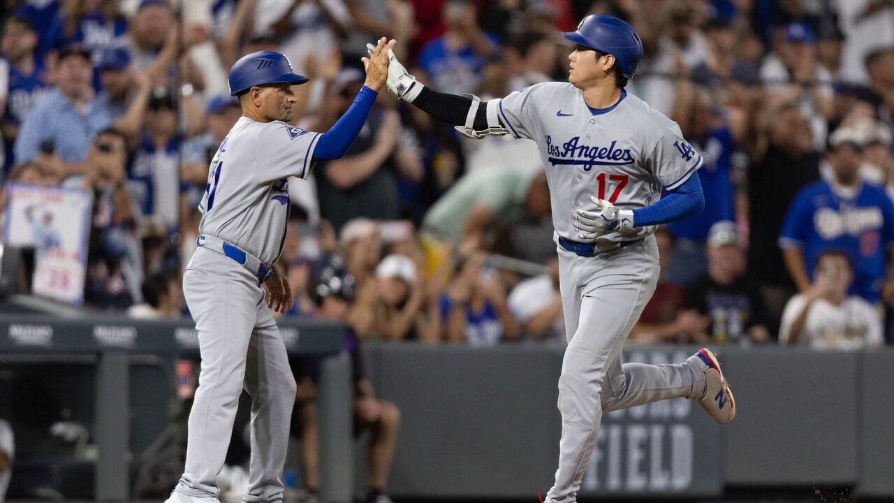DENVER, CO - AUGUST 17: Shohei Ohtani #17 of the Los Angeles Dodgers celebrates with third base coach Dino Ebel #91 after hitting a solo home run in the fifth inning during the game between the Los Angeles Dodgers and the Colorado Rockies at Coors Field on Monday, August 17, 2026 in Denver, Colorado.