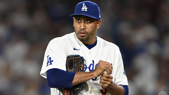 Los Angeles, CA - August 14:Dodgers closer Edwin Diaz (3) rubs the ball after he into a jam during 9th inning action at Dodger Stadium on Friday, August 14, 2026. The Dodgers defeated the Brewers 3-1.