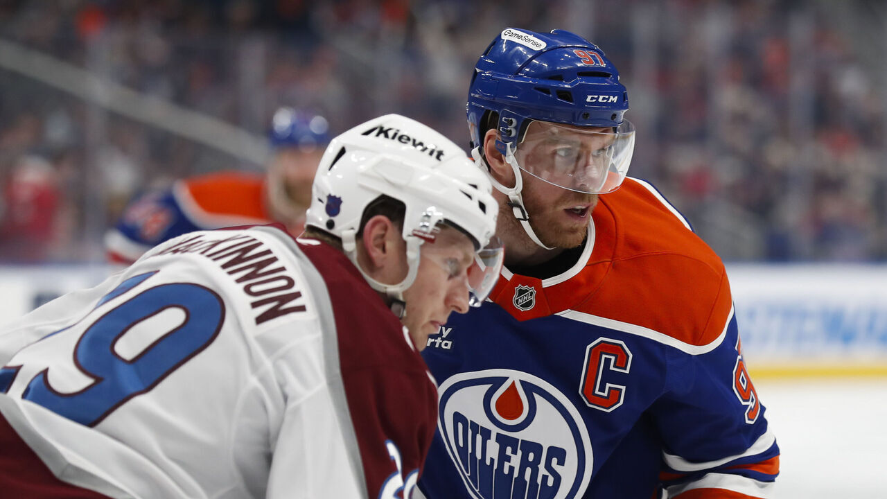 EDMONTON, CANADA - APRIL 13: Connor McDavid #97 of the Edmonton Oilers faces off against Nathan MacKinnon #29 of the Colorado Avalanche during the third period at Rogers Place on April 13, 2026 in Edmonton, Canada.