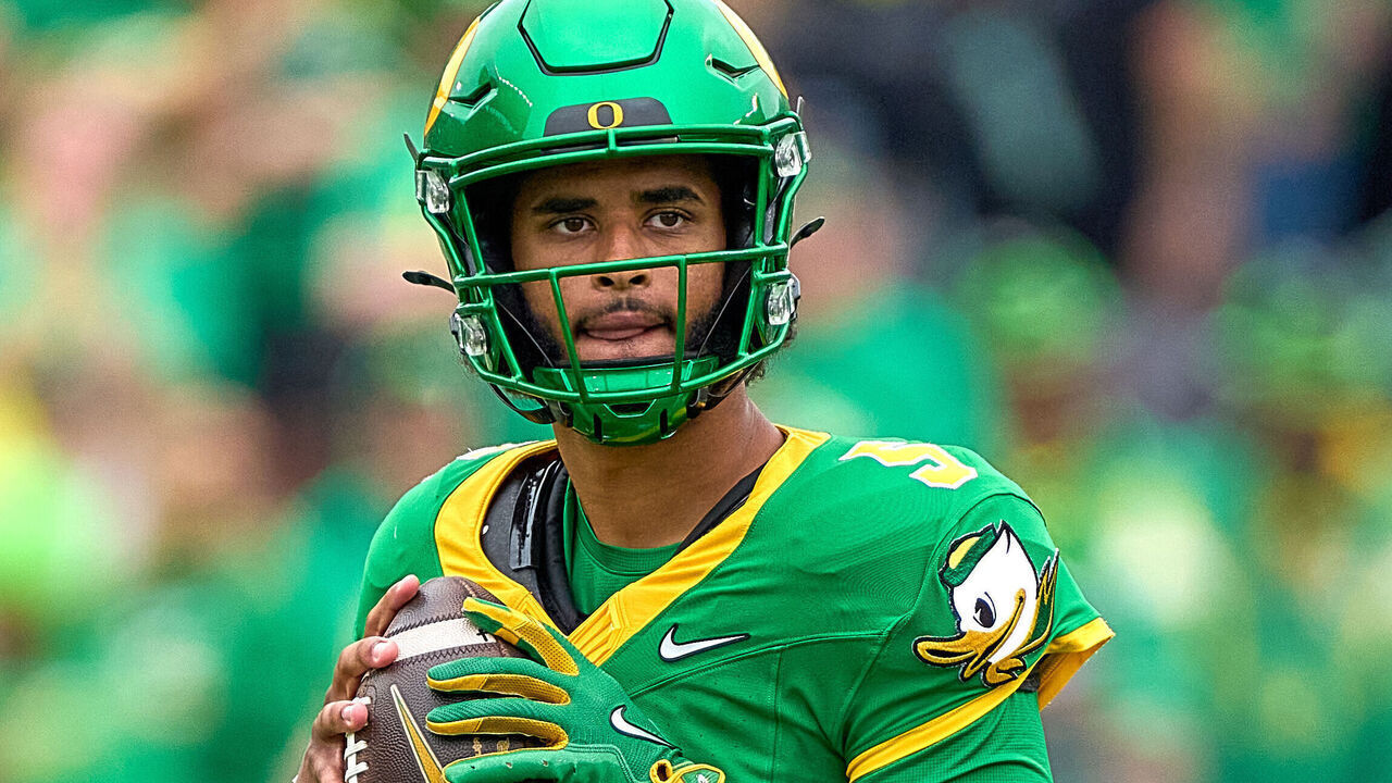 EUGENE, OREGON - SEPTEMBER 6: Dante Moore #5 of the Oregon Ducks warms up with the football in action during a game between the Oklahoma State Cowboys and the Oregon Ducks at Autzen Stadium on September 6, 2025 in Eugene, Oregon.