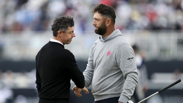 NEWTOWN, PENNSYLVANIA - MAY 14: Rory McIlroy of Northern Ireland shake hands with Jon Rahm of Spain on the ninth green during the first round of the PGA Championship at Aronimink Golf Club on May 14, 2026 in Newtown, Pennsylvania.