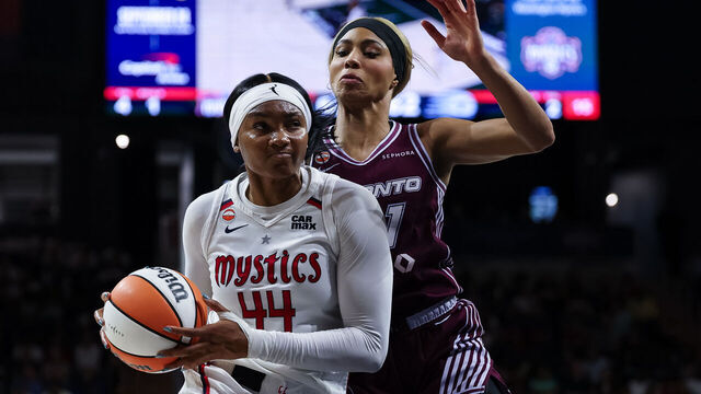 WASHINGTON, DC - AUGUST 19: Kiki Iriafen #44 of the Washington Mystics drives to the basket against Isabelle Harrison #21 of the Toronto Tempo during the second half of the game at CareFirst Arena on August 19, 2026 in Washington, DC.