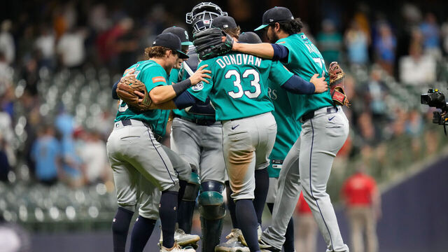 MILWAUKEE, WISCONSIN - AUGUST 19: Andrés Muñoz #75 of the Seattle Mariners and infielders celebrate a 7-4 win over the Milwaukee Brewers at American Family Field on August 19, 2026 in Milwaukee, Wisconsin.