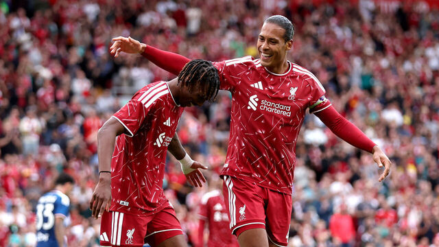 LIVERPOOL, ENGLAND - AUGUST 16: (THE SUN OUT, THE SUN ON SUNDAY OUT) Jeremy Jacquet of Liverpool celebrates scoring his team’s second goal with teammate Virgil van Dijk during the pre-season friendly match between Liverpool FC and Como Calcio at Anfield on August 16, 2026 in Liverpool, England.
