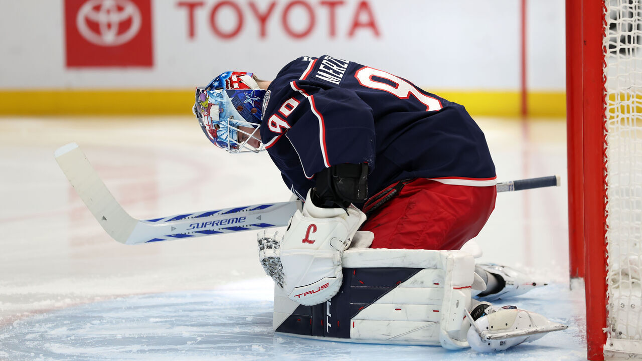 COLUMBUS, OHIO - MARCH 28: Elvis Merzlikins #90 of the Columbus Blue Jackets stretches prior to the start of the second period against the San Jose Sharks at Nationwide Arena on March 28, 2026 in Columbus, Ohio.