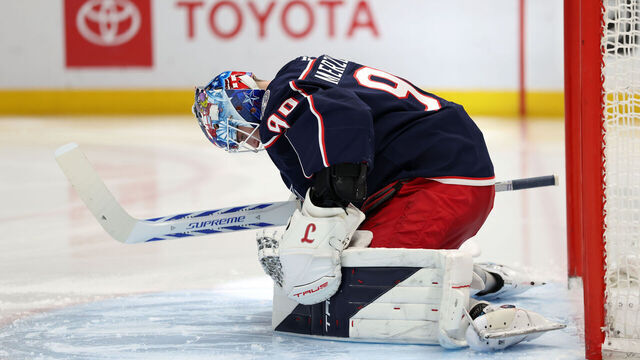 COLUMBUS, OHIO - MARCH 28: Elvis Merzlikins #90 of the Columbus Blue Jackets stretches prior to the start of the second period against the San Jose Sharks at Nationwide Arena on March 28, 2026 in Columbus, Ohio.