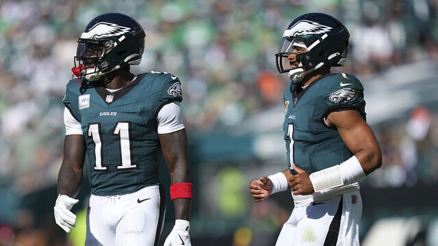 PHILADELPHIA, PENNSYLVANIA - OCTOBER 5: A.J. Brown #11 and Jalen Hurts #1 of the Philadelphia Eagles look on against the Denver Broncos at Lincoln Financial Field on October 5, 2025 in Philadelphia, United States.