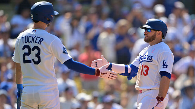 LOS ANGELES, CALIFORNIA - MAY 10: Kyle Tucker #23 of the Los Angeles Dodgers congratulates Max Muncy #13 after a two-run home run against the Atlanta Braves at Dodger Stadium on May 10, 2026 in Los Angeles, California.