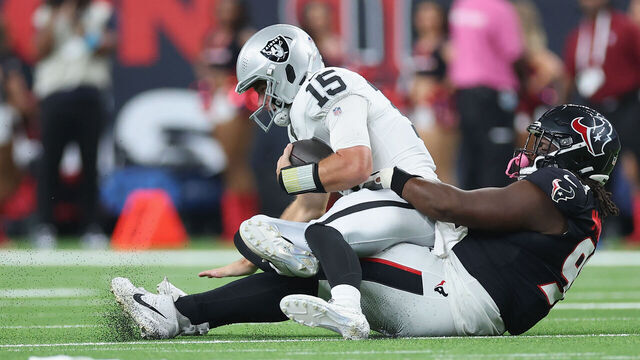 HOUSTON, TEXAS - AUGUST 20: Fernando Mendoza #15 of the Las Vegas Raiders is sacked by Kayden McDonald #93 of the Houston Texans in the first half during a preseason game at Reliant Stadium on August 20, 2026 in Houston, Texas.