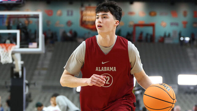 GLENDALE, ARIZONA - APRIL 05: Kai Spears #32 of the Alabama Crimson Tide dribbles the ball during a practice session at State Farm Stadium on April 05, 2024 in Glendale, Arizona.