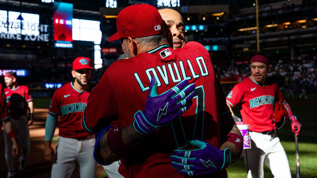 PHOENIX, ARIZONA - APRIL 05: Ketel Marte #4 of the Arizona Diamondbacks hugs manager Torey Lovullo #17 after hitting a walk off RBI double against the Atlanta Braves during the tenth inning at Chase Field on April 05, 2026 in Phoenix, Arizona.