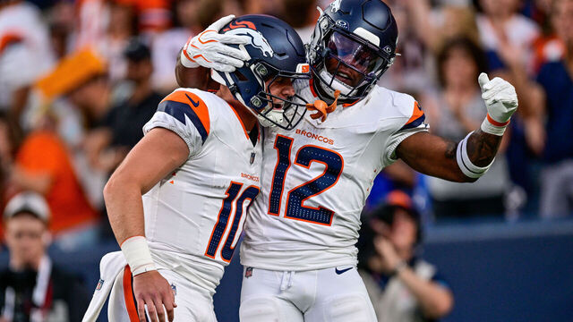 DENVER, CO - AUGUST 21: Denver Broncos quarterback Bo Nix (10) celebrates with running back RJ Harvey (12) after a first quarter touchdown pass between them during a preseason game between the Green Bay Packers and the Denver Broncos at Empower Field at Mile High on August 21, 2026 in Denver, Colorado.