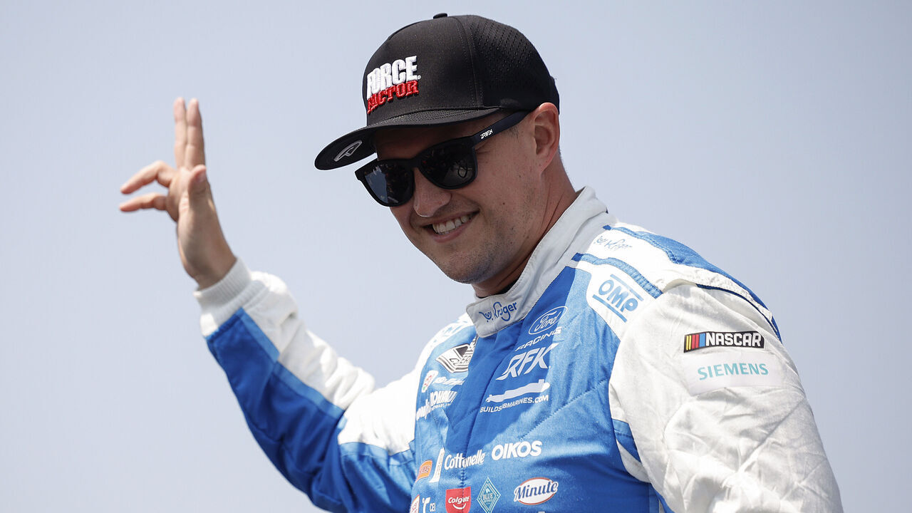 NEWTON, IOWA - AUGUST 09: Ryan Preece, driver of the #60 Kroger/Force Factor Ford, waves to fans as he walks onstage during driver intros prior to the NASCAR Cup Series Iowa Corn 350 Powered by Ethanol at Iowa Speedway on August 09, 2026 in Newton, Iowa.
