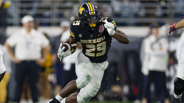 JACKSONVILLE, FL - DECEMBER 27: Missouri Tigers running back Ahmad Hardy (29) runs with the ball during the TaxSlayer Gator Bowl game between the Missouri Tigers and the Virginia Cavaliers on December 27, 2025 at EverBank Field in Jacksonville, Fl.