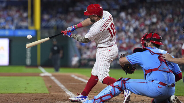 PHILADELPHIA, PENNSYLVANIA - AUGUST 22: Kyle Schwarber #12 of the Philadelphia Phillies hits a solo home run in the bottom of the eighth inning against the St. Louis Cardinals at Citizens Bank Park on August 22, 2026 in Philadelphia, Pennsylvania. The Phillies defeated the Cardinals 12-3.