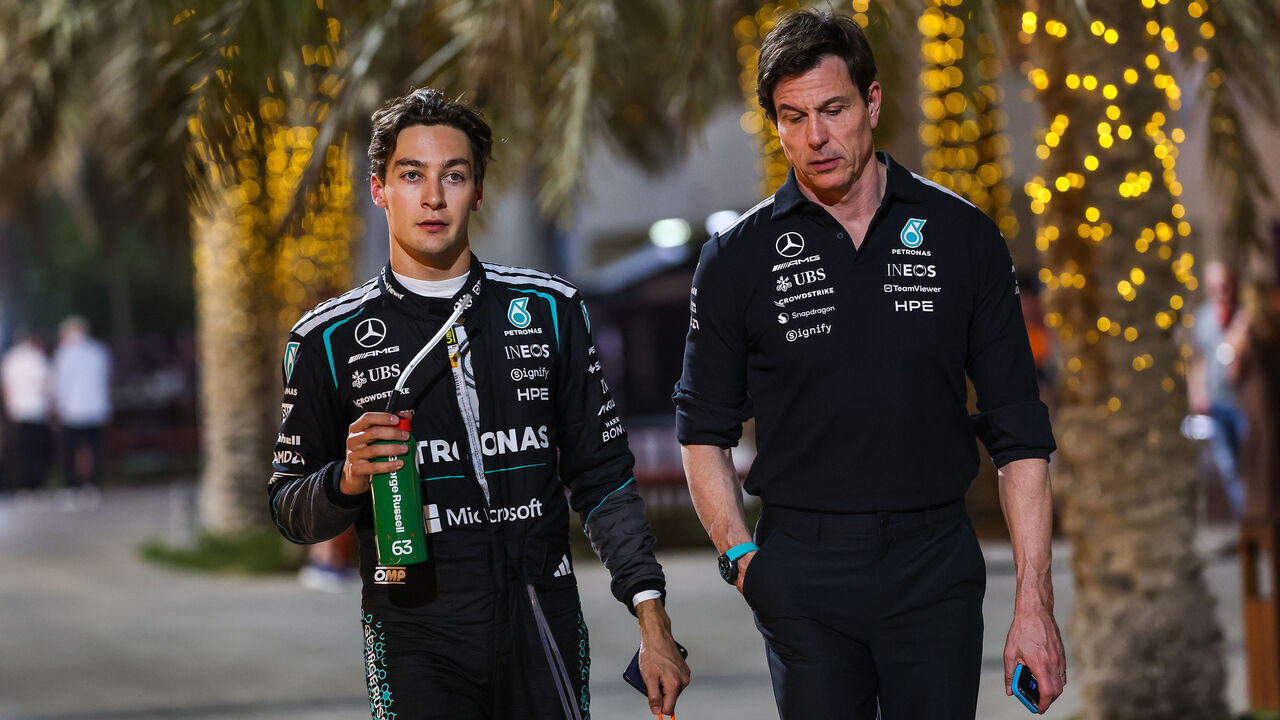 BAHRAIN, BAHRAIN - FEBRUARY 18: George Russell of Great Britain and Mercedes AMG Petronas walks in the paddock with Mercedes AMG Petronas F1 Team CEO and Team Principal Toto Wolff during day one of F1 Testing at Bahrain International Circuit on February 18, 2026 in Bahrain, Bahrain.