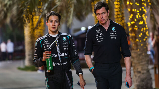 BAHRAIN, BAHRAIN - FEBRUARY 18: George Russell of Great Britain and Mercedes AMG Petronas walks in the paddock with Mercedes AMG Petronas F1 Team CEO and Team Principal Toto Wolff during day one of F1 Testing at Bahrain International Circuit on February 18, 2026 in Bahrain, Bahrain.