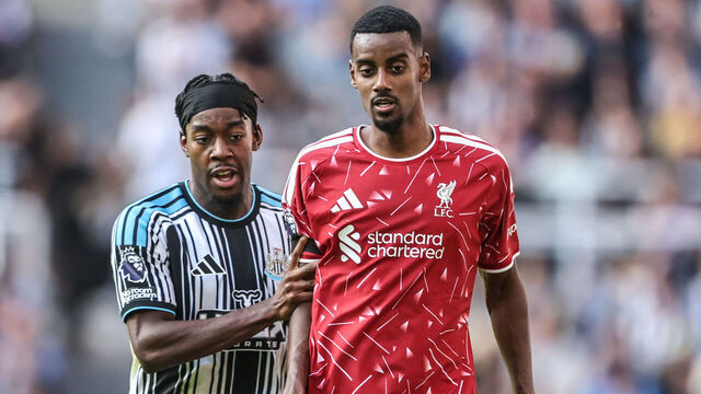 Alexander Isak of Liverpool is nudged by Anthony Elanga of Newcastle United during the Premier League match between Newcastle United and Liverpool at St. James's Park in Newcastle, United Kingdom, on August 23, 2026.