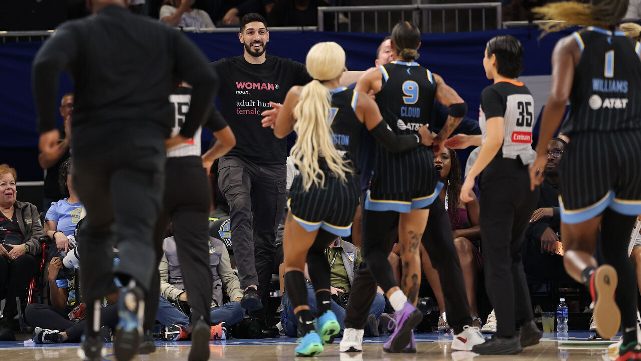 CHICAGO, ILLINOIS - AUGUST 23: Former basketball player Enes Kanter Freedom and Natasha Cloud #9 of the Chicago Sky yell at one another during the second half between the Chicago Sky and the Indiana Fever at Wintrust Arena on August 23, 2026 in Chicago, Illinois.