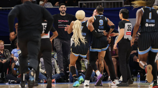 CHICAGO, ILLINOIS - AUGUST 23: Former basketball player Enes Kanter Freedom and Natasha Cloud #9 of the Chicago Sky yell at one another during the second half between the Chicago Sky and the Indiana Fever at Wintrust Arena on August 23, 2026 in Chicago, Illinois.