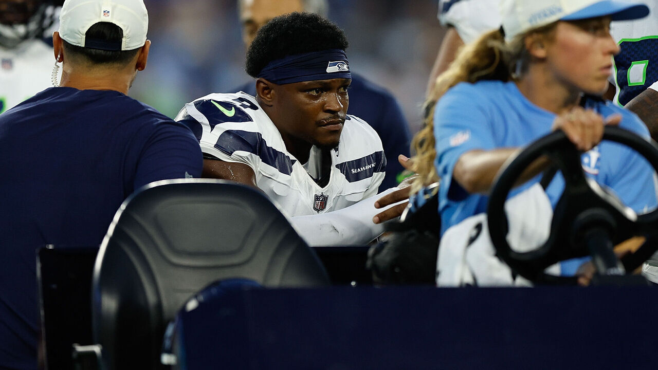 NASHVILLE, TENNESSEE - AUGUST 23: Bud Clark #9 of the Seattle Seahawks is carted off the field injured during the first half of a preseason game against the Tennessee Titans at Nissan Stadium on August 23, 2026 in Nashville, Tennessee.
