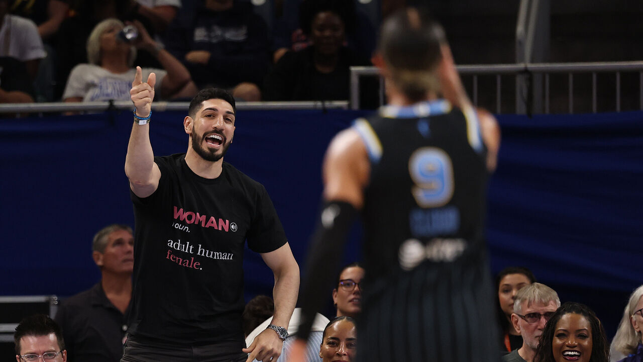 CHICAGO, ILLINOIS - AUGUST 23: Former basketball player Enes Kanter Freedom and Natasha Cloud #9 of the Chicago Sky yell at one another during the second half between the Chicago Sky and the Indiana Fever at Wintrust Arena on August 23, 2026 in Chicago, Illinois.