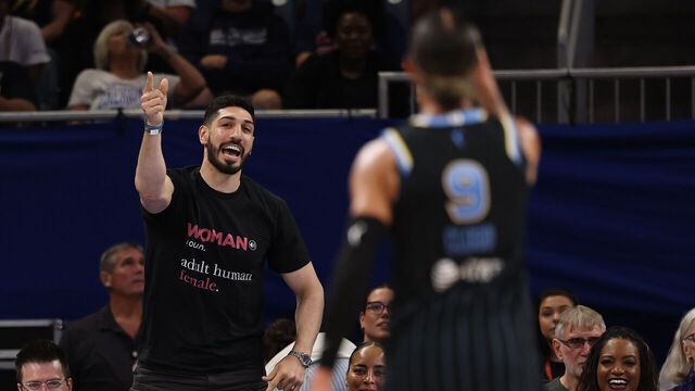 CHICAGO, ILLINOIS - AUGUST 23: Former basketball player Enes Kanter Freedom and Natasha Cloud #9 of the Chicago Sky yell at one another during the second half between the Chicago Sky and the Indiana Fever at Wintrust Arena on August 23, 2026 in Chicago, Illinois.