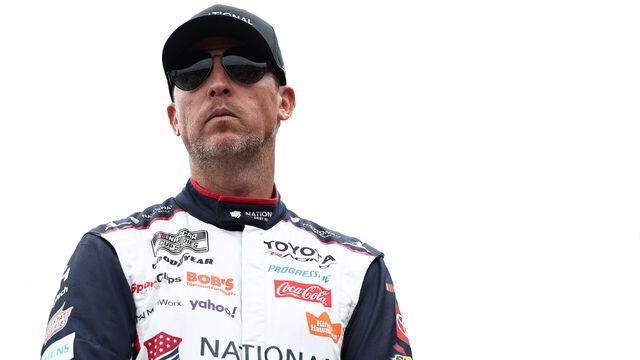 LOUDON, NEW HAMPSHIRE - AUGUST 23: Denny Hamlin, driver of the #11 National Debt Relief Toyota, looks on backstage during pre-race ceremonies prior to the NASCAR Cup Series Dollar Tree 301 at New Hampshire Motor Speedway on August 23, 2026 in Loudon, New Hampshire.