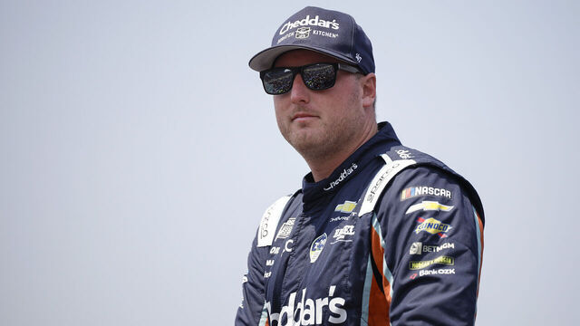 NEWTON, IOWA - AUGUST 09: Austin Hill, driver of the #33 Cheddar's Scratch Kitchen Chevrolet, walks onstage during driver intros prior to the NASCAR Cup Series Iowa Corn 350 Powered by Ethanol at Iowa Speedway on August 09, 2026 in Newton, Iowa.