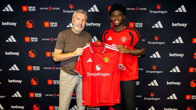 MANCHESTER, ENGLAND - AUGUST 25: (EXCLUSIVE COVERAGE) Carlos Baleba of Manchester United poses with Director of Football Jason Wilcox after signing for the club at Carrington Training Ground on August 25, 2026 in Manchester, England.