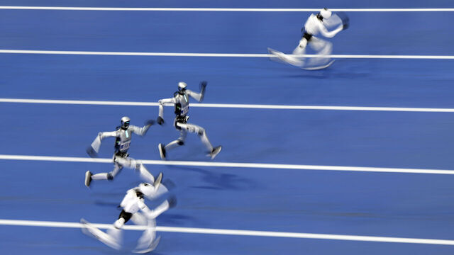 BEIJING, CHINA - AUGUST 25: Humanoid robots compete in the 100-meter small group event on day 4 of the 2nd World Humanoid Robot Games at National Speed Skating Oval on August 25, 2026 in Beijing, China.