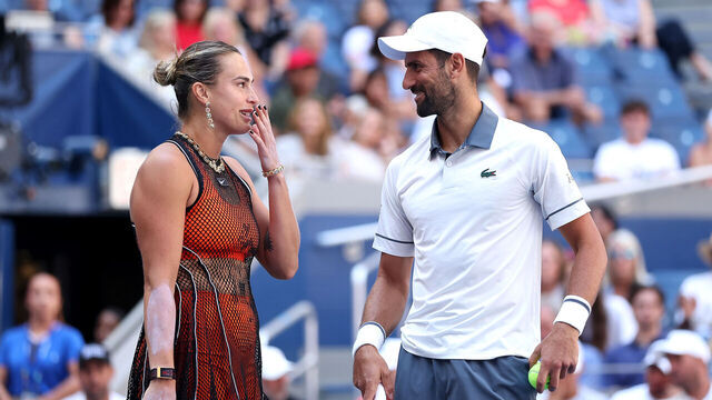 NEW YORK, NEW YORK - AUGUST 25: Novak Djokovic of Serbia and Aryna Sabalenka interact in their Mixed Doubles match during Fan Week at the USTA Billie Jean King National Tennis Center on August 25, 2026 in the Flushing neighborhood of the Queens borough of New York City.