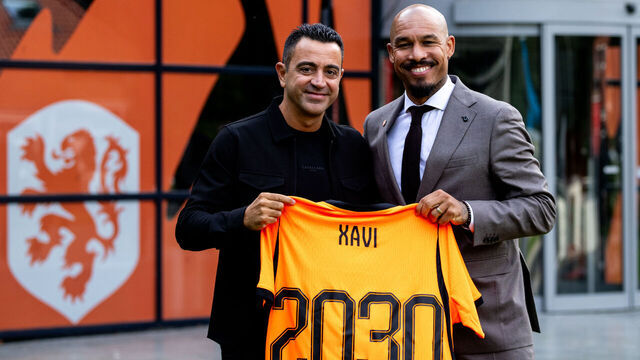 ZEIST, NETHERLANDS - AUGUST 25: Netherlands head coach Xavi Hernandez and KNVB director of football Nigel de Jong pose with a Netherlands jersey during the unveiling of Xavi Hernandez as the new head coach of the Netherlands men's football team at the KNVB Campus on August 25, 2026 in Zeist, Netherlands.