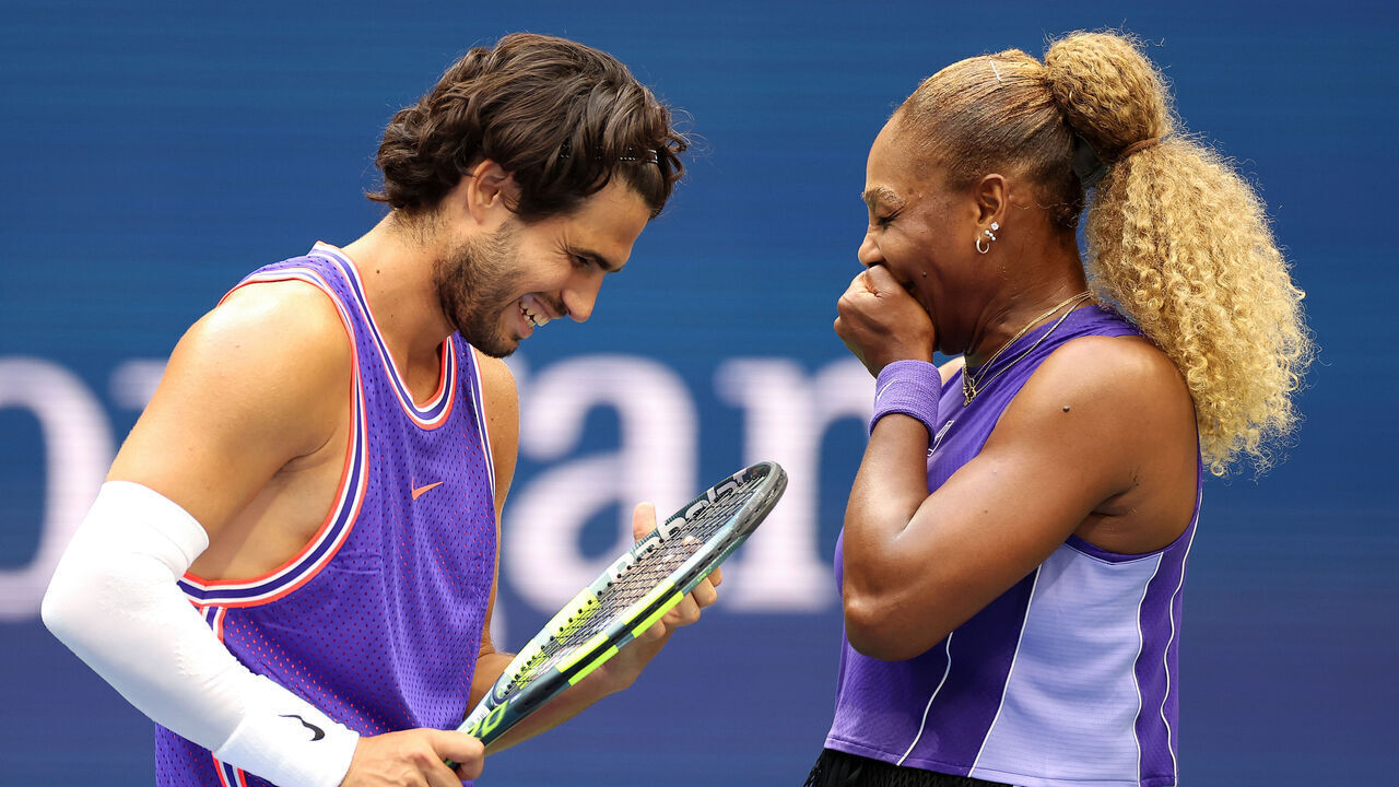 NEW YORK, NEW YORK - AUGUST 25: Carlos Alcaraz of Spain interacts with Serena Williams of the United States in their mixed doubles match against Erin Routliffe of New Zealand and Lloyd Glasspool of the United Kingdom during Fan Week at the USTA Billie Jean King National Tennis Center on August 25, 2026 in the Flushing neighborhood of the Queens borough of New York City.