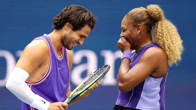 NEW YORK, NEW YORK - AUGUST 25: Carlos Alcaraz of Spain interacts with Serena Williams of the United States in their mixed doubles match against Erin Routliffe of New Zealand and Lloyd Glasspool of the United Kingdom during Fan Week at the USTA Billie Jean King National Tennis Center on August 25, 2026 in the Flushing neighborhood of the Queens borough of New York City.