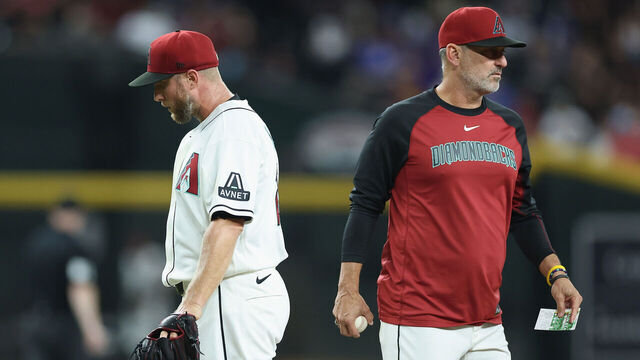 PHOENIX, ARIZONA - AUGUST 24: Starting pitcher Merrill Kelly #29 of the Arizona Diamondbacks is removed by manager Torey Lovullo #17 during the sixth inning of the MLB game against the Chicago Cubs at Chase Field on August 24, 2026 in Phoenix, Arizona.