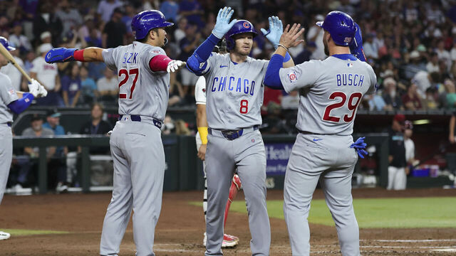 PHOENIX, AZ - AUGUST 25: Ian Happ #8 of the Chicago Cubs celebrates with Seiya Suzuki #27 and Michael Busch #29 after hitting a three run home run in the fourth inning during the game between the Chicago Cubs and the Arizona Diamondbacks at Chase Field on Tuesday, August 25, 2026 in Phoenix, Arizona.