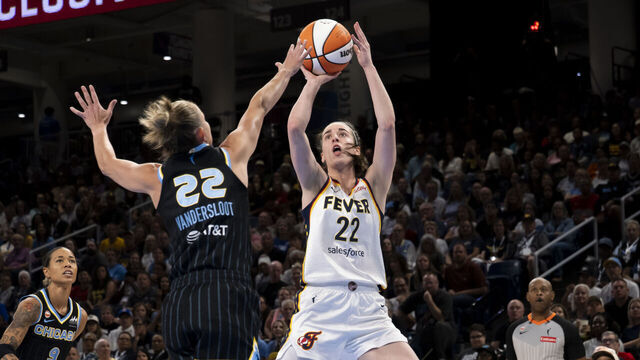 CHICAGO, IL - AUGUST 23: Caitlin Clark #22 of the Indiana Fever shoots a basket against Courtney Vandersloot #22 of the Chicago Sky during the regular season WNBA game between the Indiana Fever and the Chicago Sky on August 23, 2026 at the Wintrust Arena in Chicago, Illinois.