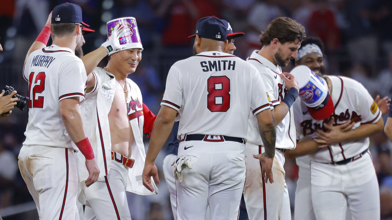 ATLANTA, GEORGIA - AUGUST 26: Ha-Seong Kim #7 of the Atlanta Braves reacts with teammates after hitting a walk off single during the ninth inning against the Los Angeles Dodgers at Truist Park on August 26, 2026 in Atlanta, Georgia.