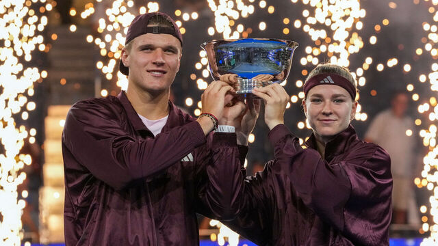 Czech Republic's Jakub Mensik and Czech Republic's Karolina Muchova hold up the trophy after they beat Switzerland's Belinda Bencic and Italy's Flavio Cobolli in the mixed doubles final tennis match of the 2026 US Open tennis tournament at the USTA Billie Jean King National Tennis Center in New York on August 26, 2026.