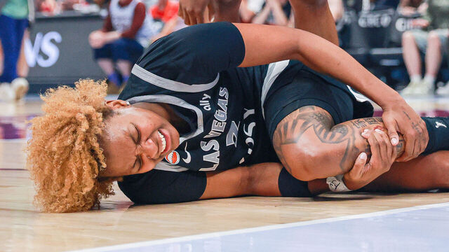VANCOUVER, BRITISH COLUMBIA - AUGUST 23: NaLyssa Smith #3 of the Las Vegas Aces reacts after sustaining an injury during against the Toronto Tempo at Rogers Arena on August 23, 2026 in Vancouver, British Columbia.