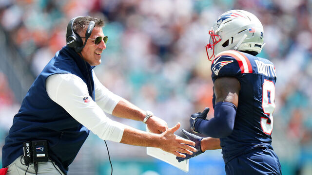 MIAMI GARDENS, FLORIDA - SEPTEMBER 14: Kayshon Boutte #9 of the New England Patriots is congratulated by head coach Mike Vrabel after scoring a touchdown reception against the Miami Dolphins during the first quarter in the game at Hard Rock Stadium on September 14, 2025 in Miami Gardens, Florida.
