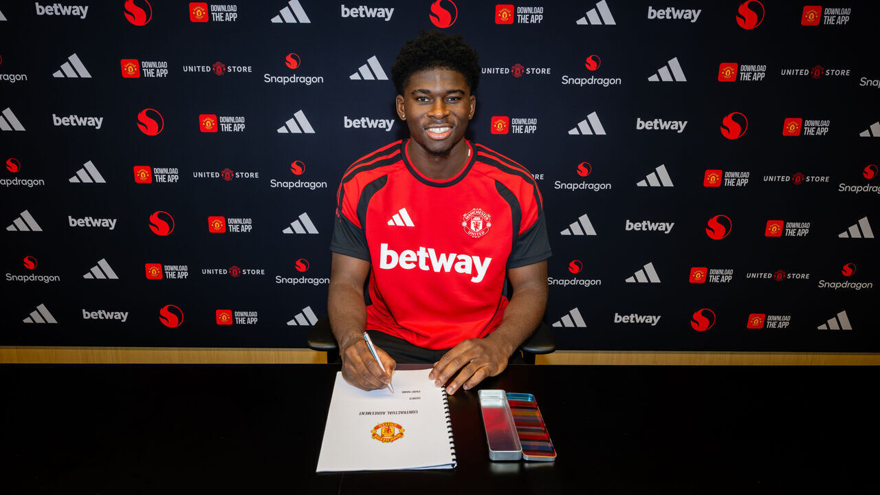 MANCHESTER, ENGLAND - AUGUST 25: (EXCLUSIVE COVERAGE) Carlos Baleba of Manchester United poses after signing for the club at Carrington Training Ground on August 25, 2026 in Manchester, England.