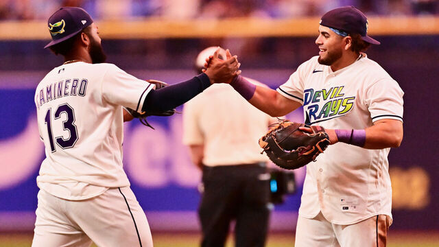 ST PETERSBURG, FLORIDA - AUGUST 28: Junior Caminero #13 celebrates with Jonathan Aranda #8 of the Tampa Bay Rays after defeating the San Diego Padres 9-4 at Tropicana Field on August 28, 2026 in St Petersburg, Florida.