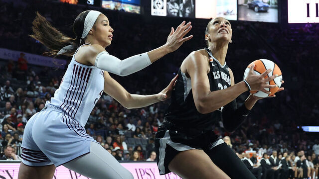 LAS VEGAS, NEVADA - AUGUST 28: A'ja Wilson #22 of the Las Vegas Aces drives to the basket against Isabelle Harrison #21 of the Toronto Tempo in the fourth quarter of their game at Michelob ULTRA Arena on August 28, 2026 in Las Vegas, Nevada. The Aces defeated the Tempo 93-73.