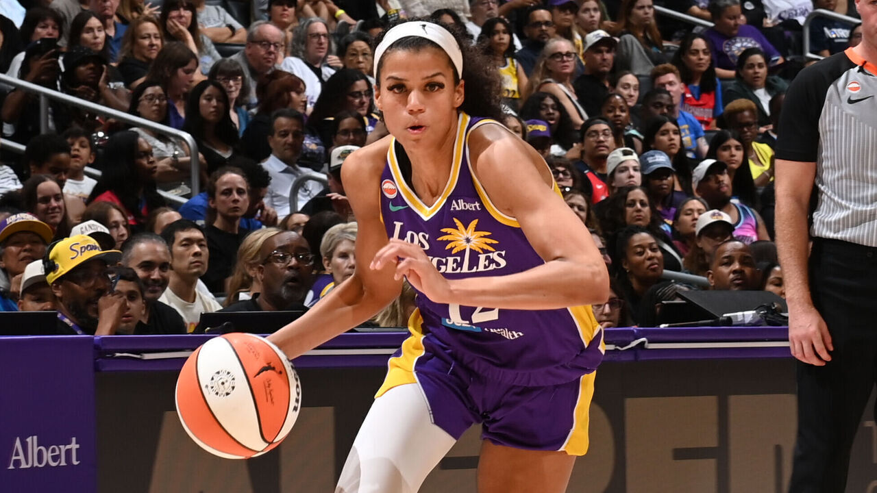 LOS ANGELES, CA - AUGUST 28: Rae Burrell #12 of the Los Angeles Sparks dribbles the ball during the game against the Washington Mystics on August 28, 2026 at Crypto.com Arena in Los Angeles, California. NOTE TO USER: User expressly acknowledges and agrees that, by downloading and/or using this Photograph, user is consenting to the terms and conditions of the Getty Images License Agreement. Mandatory Copyright Notice: Copyright 2026 NBAE