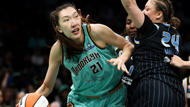 BROOKLYN, NEW YORK - AUGUST 29: Han Xu #21 of the New York Liberty drives towards the basket against Rachel Banham #24 of the Chicago Sky during the fourth quarter at Barclays Center on August 29, 2026 in Brooklyn, New York.