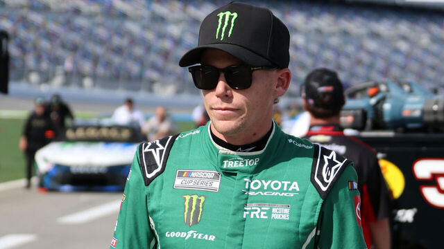 DAYTONA BEACH, FL - AUGUST 28: Riley Herbst (#35 23XI Racing TREETOP Toyota) walks down pit road before qualifying for the NASCAR Cup Series Coke Zero Sugar 400 on August 28, 2026 at Daytona International Speedway in Daytona Beach, FL.