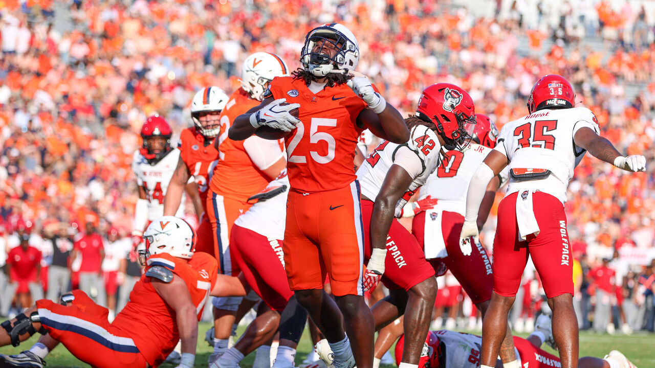CHARLOTTESVILLE, VIRGINIA - AUGUST 29: Xay Davis #25 of the Virginia Cavaliers celebrates after scoring a touchdown during a game between the Virginia Cavaliers and the NC State Wolfpack at Scott Stadium on August 29, 2026 in Charlottesville, Virginia.