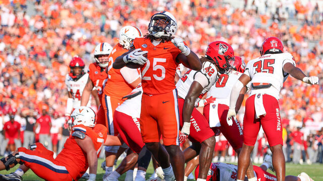 CHARLOTTESVILLE, VIRGINIA - AUGUST 29: Xay Davis #25 of the Virginia Cavaliers celebrates after scoring a touchdown during a game between the Virginia Cavaliers and the NC State Wolfpack at Scott Stadium on August 29, 2026 in Charlottesville, Virginia.